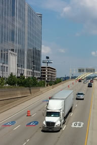 Truck on urban interstate.