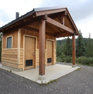 a building housing two vault toilets