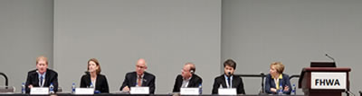 Image of 6 panelists sitting during panel discussion.