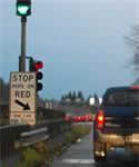 A left-side shoulder-mounted ramp meter and signs