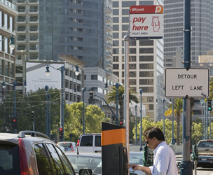 Cover graphic shows a view of a street in San Francisco with a kiosk for making a payment to park.