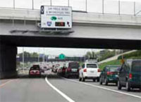 Photo. View of a Minneapolis roadway with vehicles using toll lane and general purpose lanes.  The toll lane is less congested.