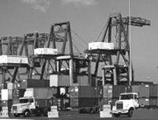 Picture of truck-rail intermodal facility, with cranes and containers.