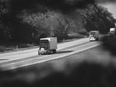 Picture of trucks on rural highway.