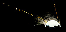 Vehicles going through a tunnel.