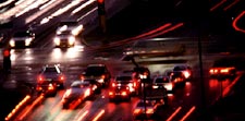 Vehicles at Night at Highway Intersection