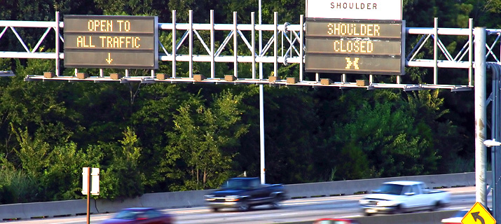 Variable message signs for the use of dynamic shoulder lanes showing shoulder lane closed. 