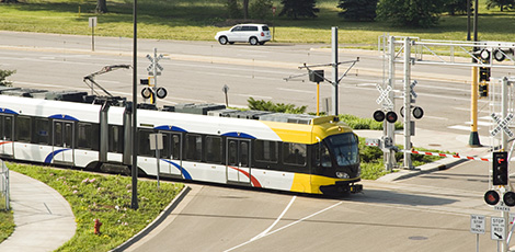 Light-rail train passing through street intersection