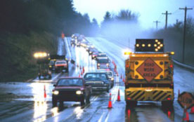 Figure 15: Photo: Roadway with restricted lane and signage for Road Work Ahead.