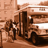 passengers boarding a para transit van