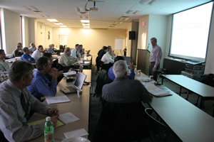 An image showing representatives from Law Enforcement and Transportation in a conference room. Speaker: Dave Helman