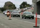 Photograph. An I-580 on-ramp is shown with vehicles entering the highway.