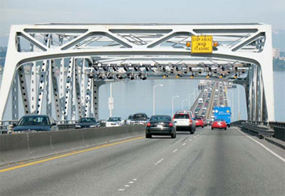 Another photo of existing SR 520 bridge, showing toll gantries.