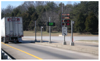 A truck departing a weigh-in-motion station.