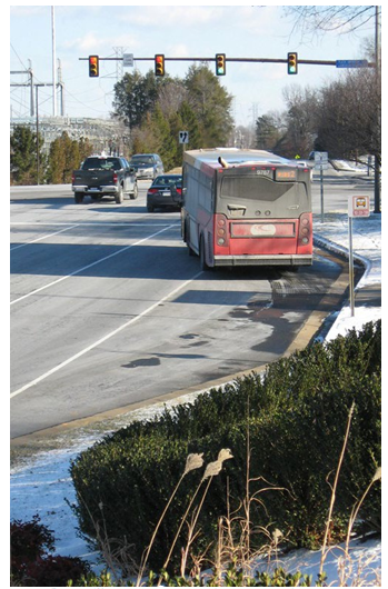 A bus merging back into traffic from a bus turnout.