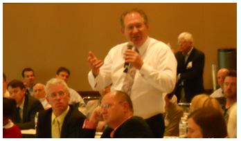 Conference attendees participating in discussion.