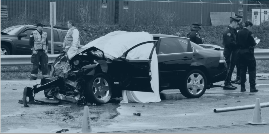 Crashed car with severe front damage.