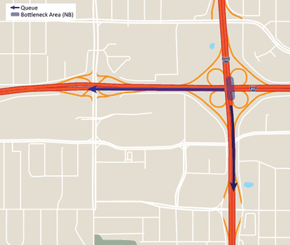 Figure 31 is a map showing a bottleneck at an interchange between two major roadways, a northbound bottleneck area at the interchange, and the queue reaching south and west on the roadways due to the bottleneck.