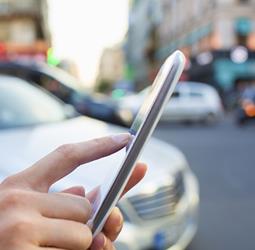 a smartphone used to arrange a vehicle service