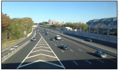 Image shows a section of the Dulles Corridor in northern Virginia, an example of a corridor defined around a major highway and passenger rail spine with adjoining roadways, park-and-ride facilities, and surrounding business and residential land uses.