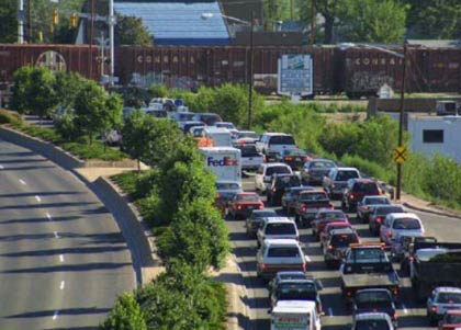 Figure 20 is a photo of traffic backed up on northbound Wadsworth prior to the grade separation project. It is noted that a restaurant shown to the right of the traffic queue had to be relocated as part of the project.