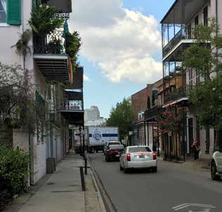 photo of a New Orleans street showing traffic blocked by an oversized truck