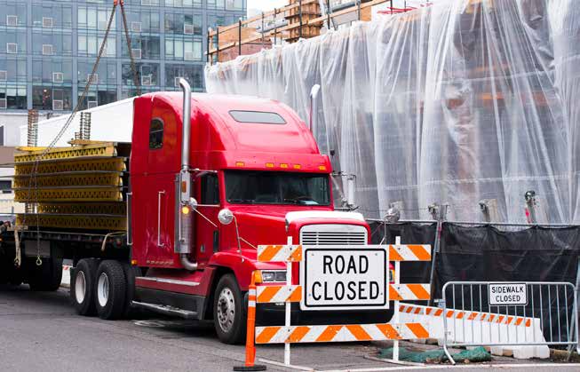 photo of a truck with construction materials at a city construction site