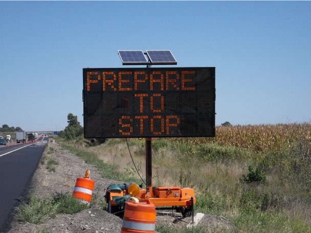 a Picture of a SWZ Queue Advance Warning Sign that reads - Prepare to Stop.