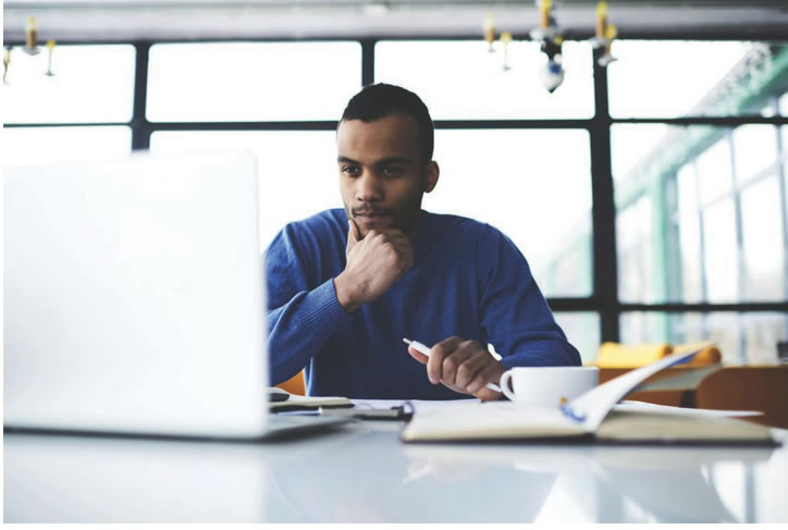 Man looking at laptop