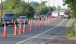 photo showing a two-lane arterial coned for temporary three-lane operation