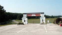 photo showing a gate to a venue parking area that consists of four access lanes, each with available queue storage