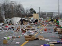 photo of trailer load spilled across a road