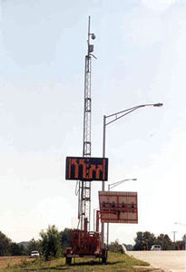 Photograph of portable, solar-powered traveler information system near Kansas Speedway