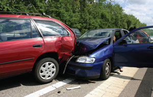 Photo of two cars moved safely to the side of the road after a fender bender.