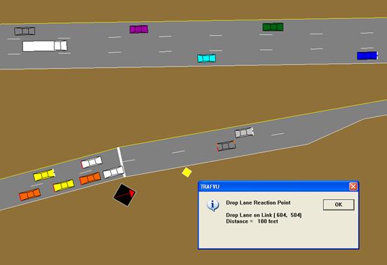 This figure is a TRAFVU drawing of an on-ramp with a ramp meter.  The on-ramp has a lane drop a short distance downstream of the ramp meter.  Placing the warning sign for the lane drop downstream of the ramp meter permits both lanes of the ramp to be fully used at the ramp meter.  If the warning sign were located upstream of the ramp meter, vehicles would avoid the lane leading to the lane drop and not fully use the ramp meter.