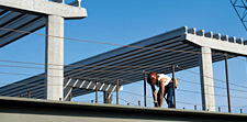 Highway worker building a bridge