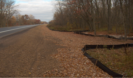 Stream realignment to one side of finished roadway.