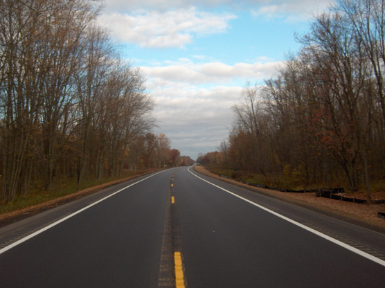 Finished roadway stretching into the distance.