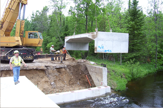 Hy-Span pre-cast bridge being installed.