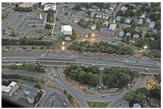 Aerial photo depicts machinery at work as demolition of the bridge deck begins.