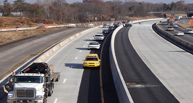 Image shows a work zone in the median of a restricted access highway.