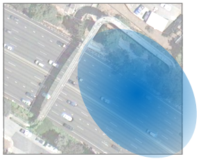 An overhead image of 5-lane restricted access highway with an elliptical highlighted area focused on the right-hand lane.