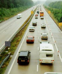 Overhead photo of two lanes of traffic next to an empty work zone lane.