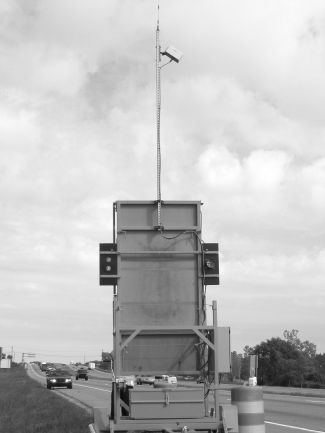 This figure shows the back side of the Dynamic Lane Merge Trailer. Enforcement personnel use the light shown on the back of the trailer to monitor motorist compliance with the signs.  