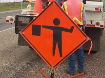 Fluorescent orange roll-up sign